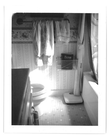 This photograph here is of my parent’s bathroom. If you look closely, you’ll see a metal basket attached to the wall and inside—a bible and a wooden back scratcher.