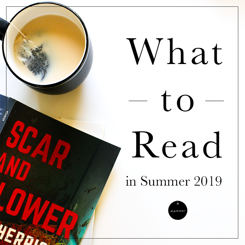 Photograph of a black mug containing milky tea and a copy of Lee Herrick's SCAR AND FLOWER lying open on its front (with the cover up—showing large, red-and-white, sans-serif display type on a dark background). The words "What to Read in Summer 2019" and the Lumen logo (a black circle with a white, hanging line-drawing of a pendant lamp and the word "Lumen" in white script font) take up the right side.