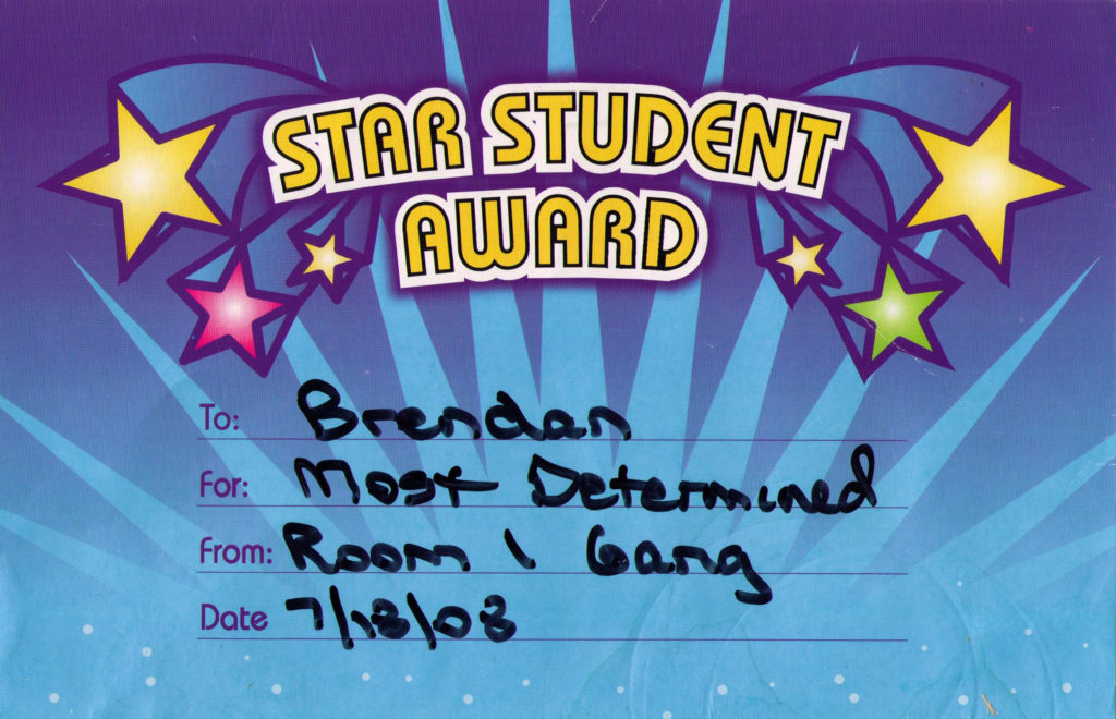 Blue award certificate featuring colorful stars and the words, "Star Student Award. To: Brendan. For: Most Determined. From: Room 1 Gang. Date 7/18/08"